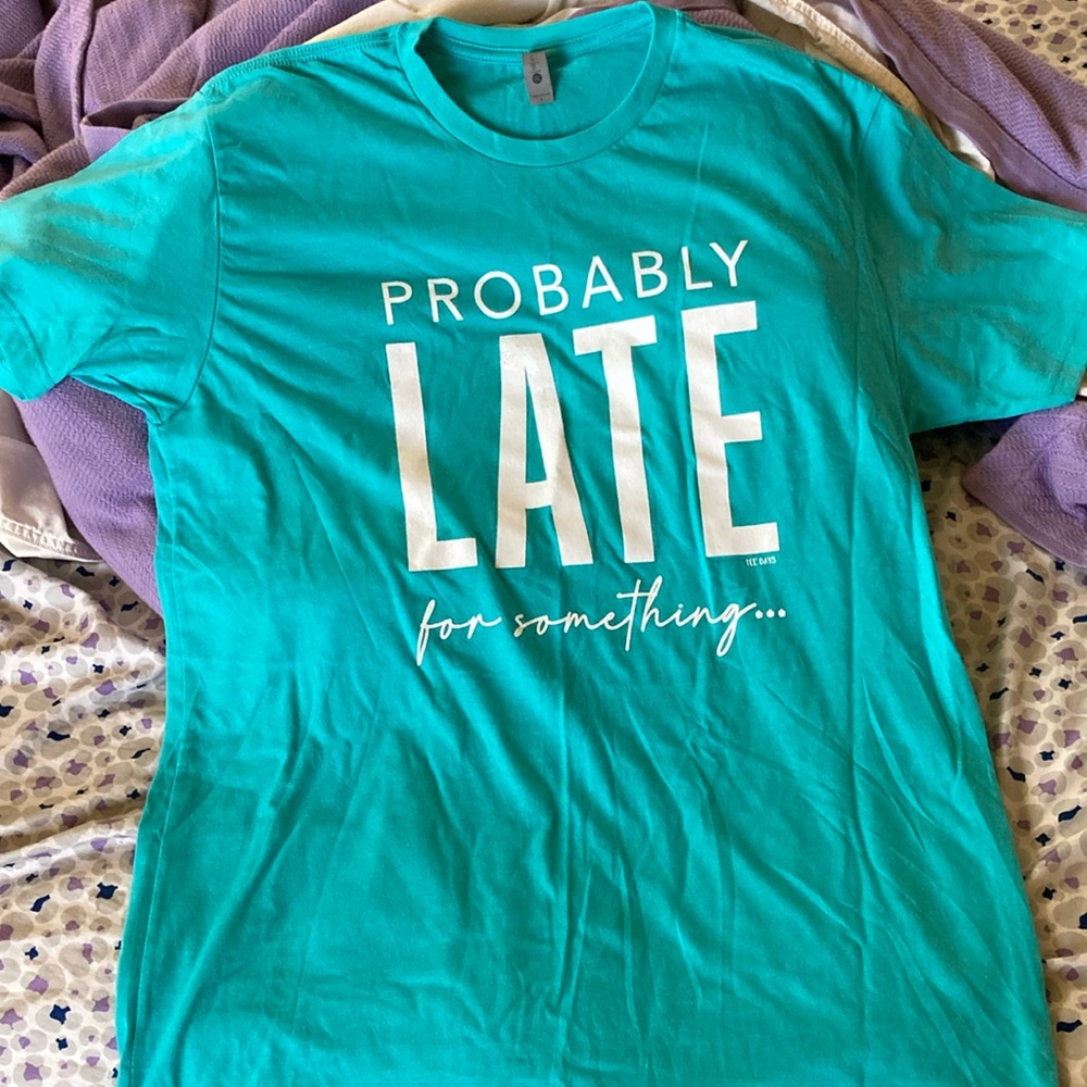 T-shirt that says “Probably Late For Something “New Smoke free home never worn !